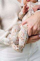 pearl zipper footies close up on print and fooites
